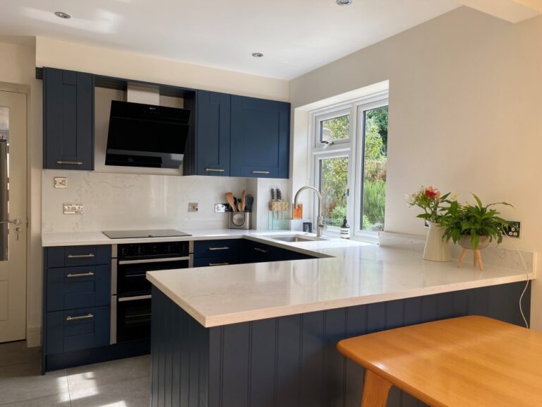 Painted dark blue shaker kitchen by JJO.