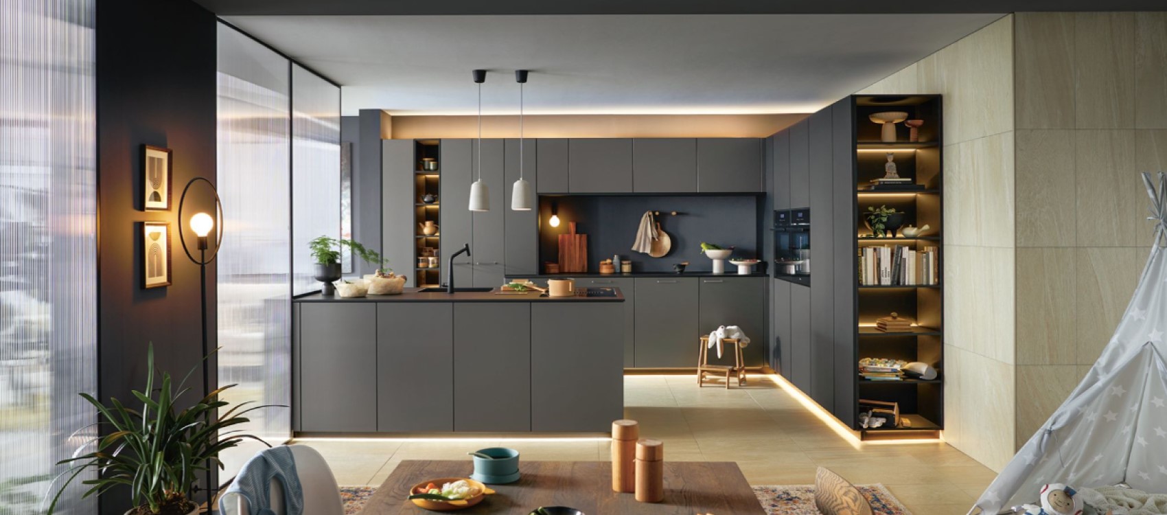 Schuller Smartglas kitchen in Titanio finish with backlit open shelving.