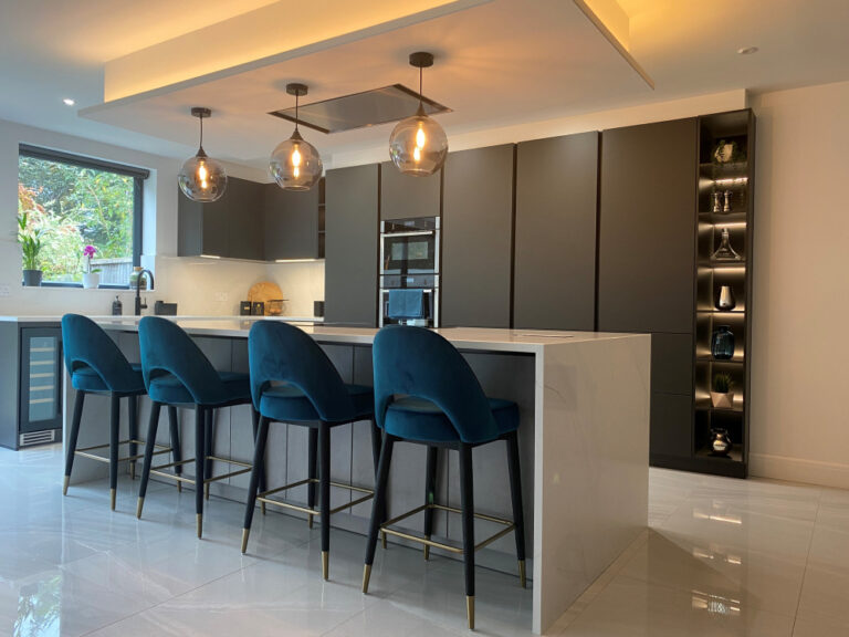 Kitchen with lava black tall units and concrete effect island units