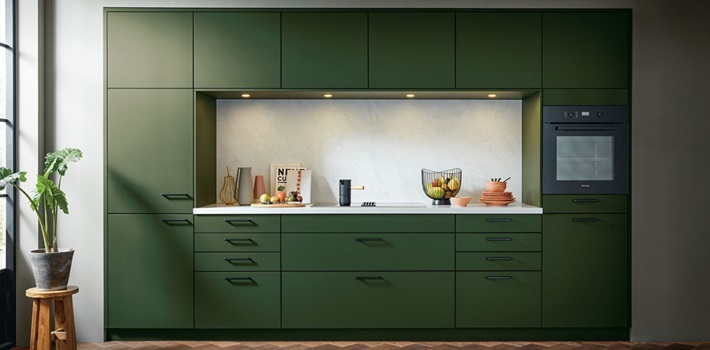 Green kitchen with handles